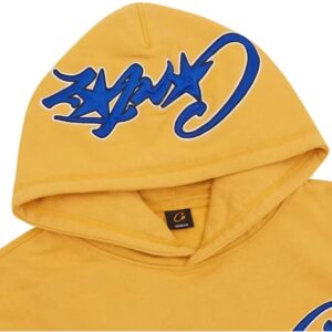 corteiz satin c star appliqué hoodie mustard