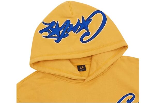 corteiz satin c star appliqué hoodie mustard